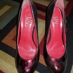 Shiny black and red heels